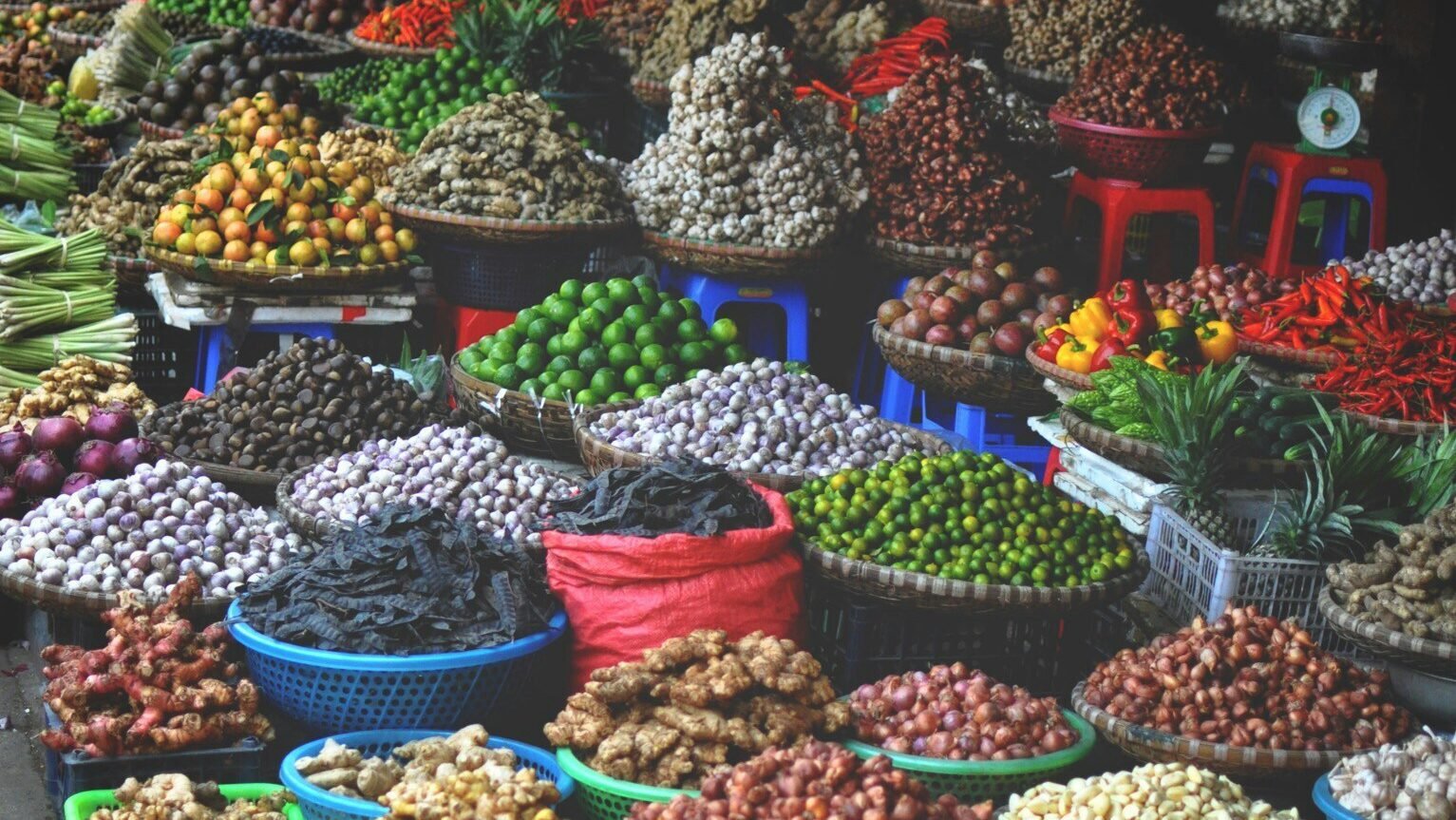 assorted spices on containers at the market